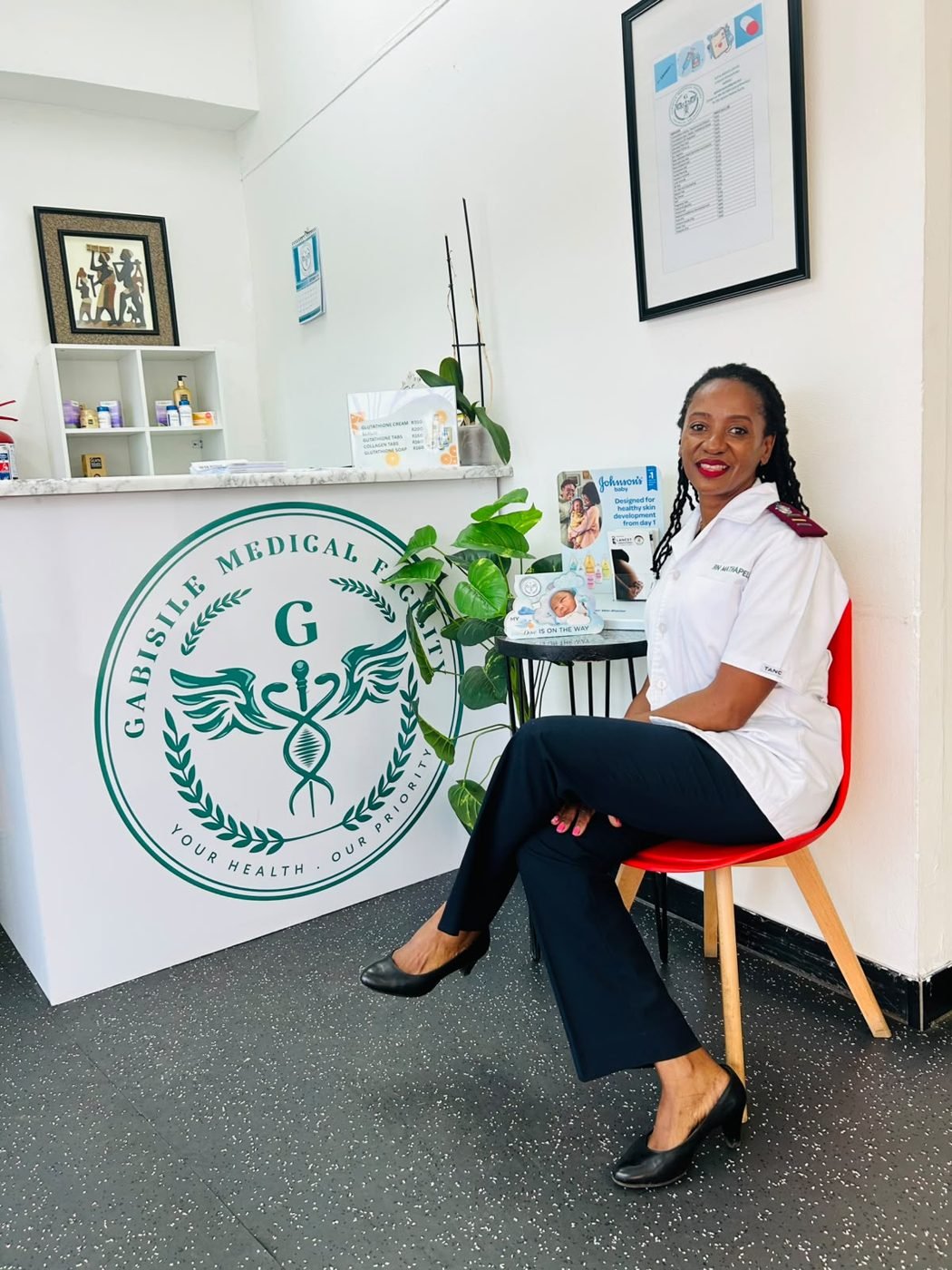 The nurse seated in the waiting area